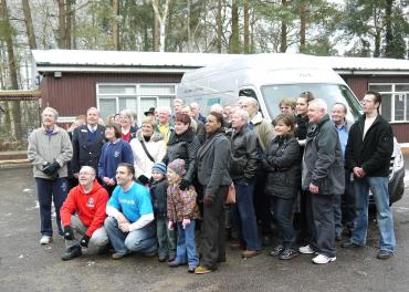 Sponsors & volunteer helpers pose for press photographer